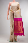 Pure Silk Beige Kanchipuram Saree with Jacquard With Zari Butta on the body and Without Border.  displayed on a mannequin