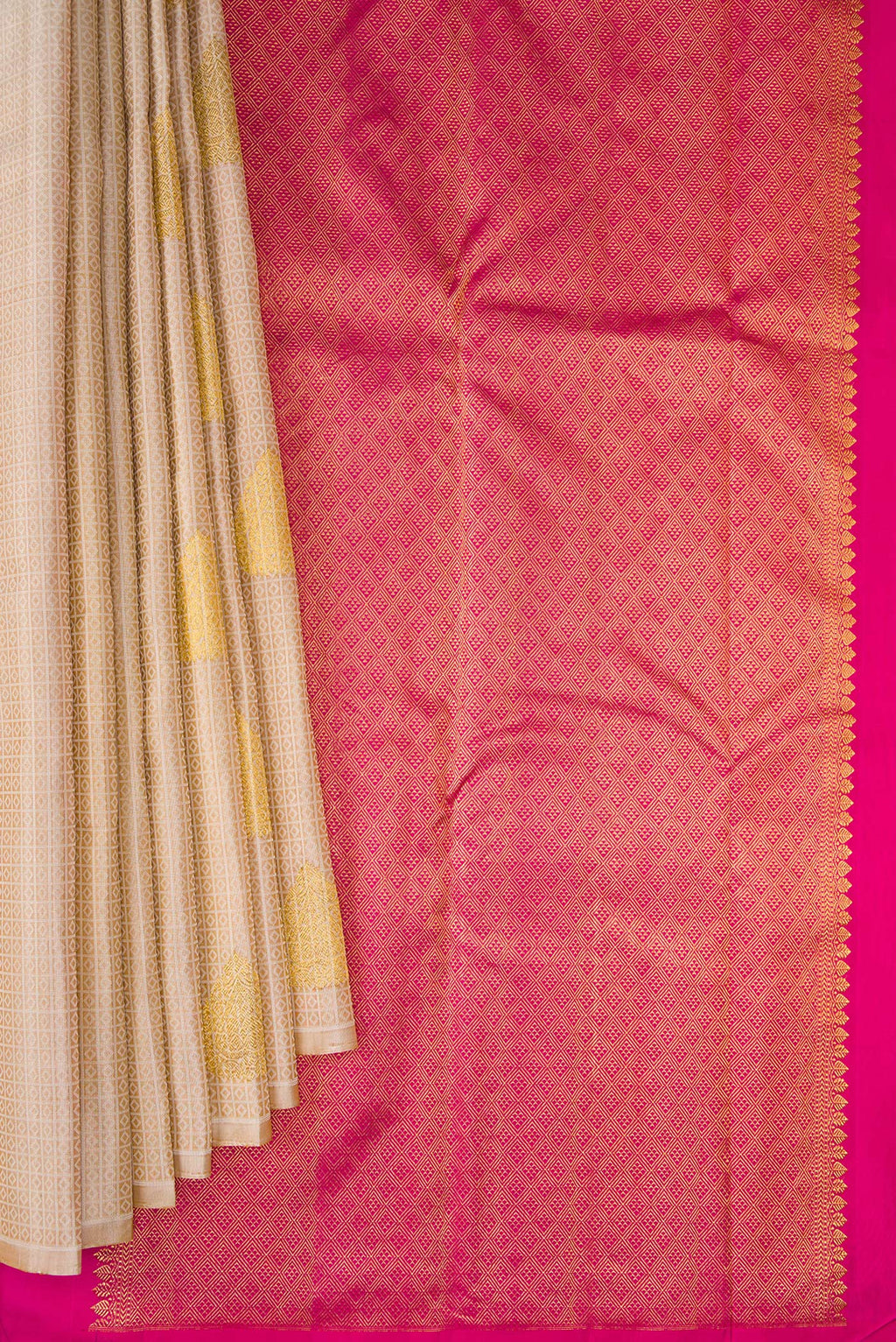 Pleats and pallu of Pure Silk Beige Kanchipuram Saree with Jacquard With Zari Butta on the body and Without Border. 