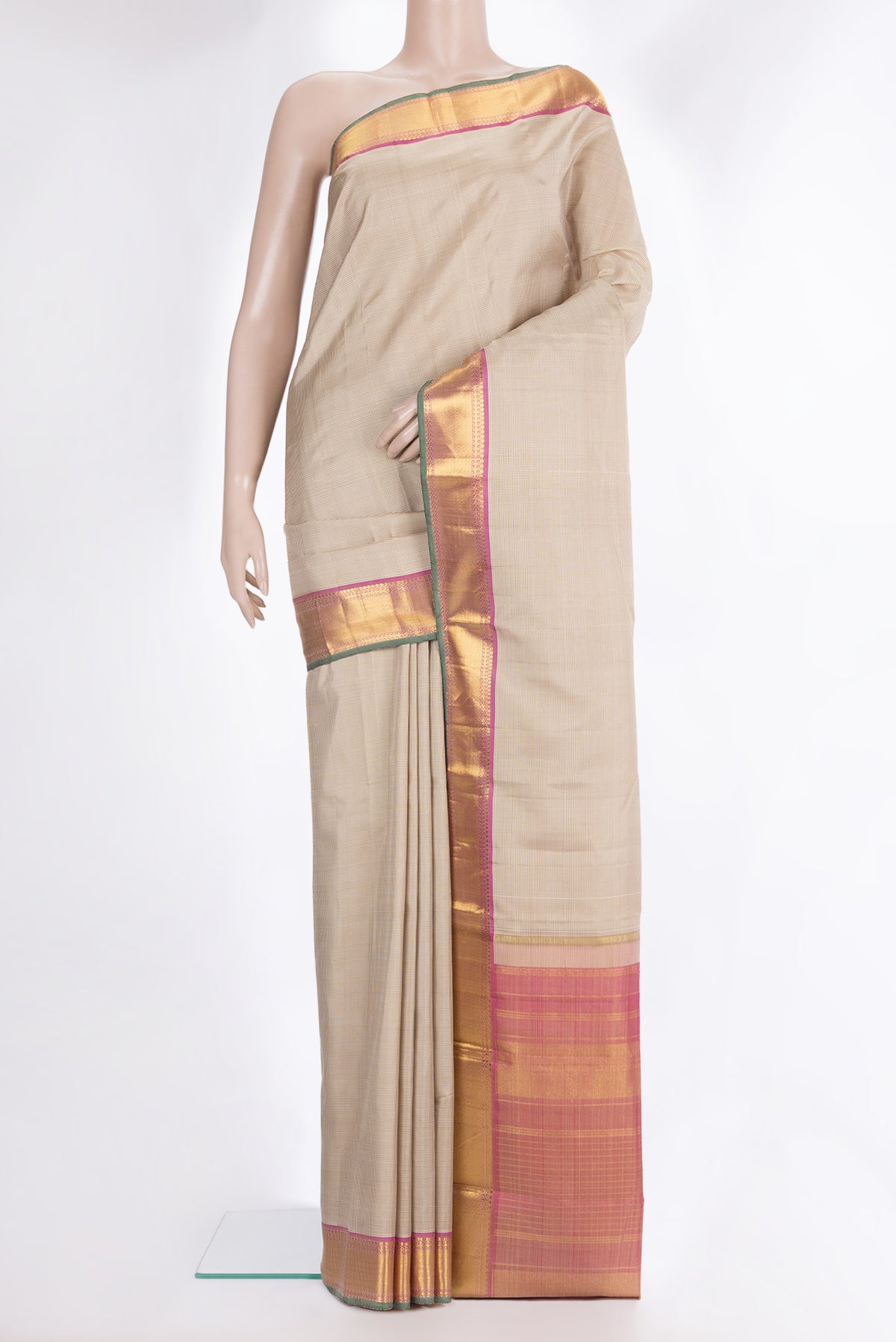 Pure Silk Beige Kanchipuram Saree with Checked design on the body and Zari Border.  displayed on a mannequin