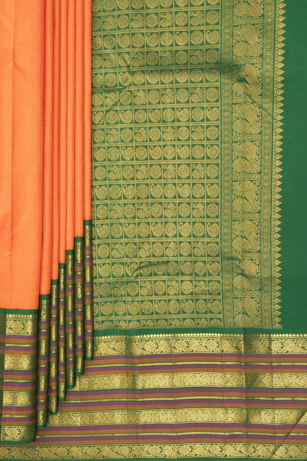 Pleats and pallu of Pure Silk Orange Kanjivaram Saree with Plain Body and Zari Border. 