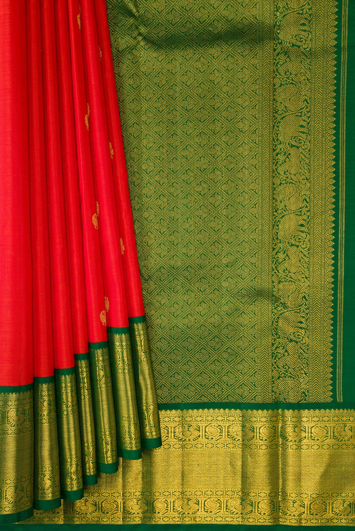 Pleats and pallu of Pure Silk Orange Kanjivaram Saree with Zari Butta on the body and Zari Border. 