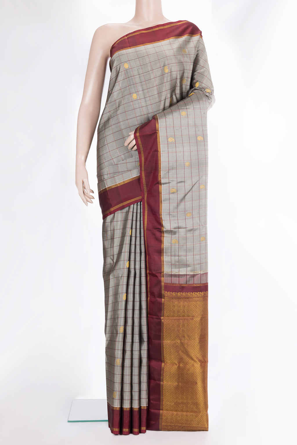 Pure Silk Grey Dual Tone Kanjivaram Saree with Checked design on the body and Zari Border.  displayed on a mannequin