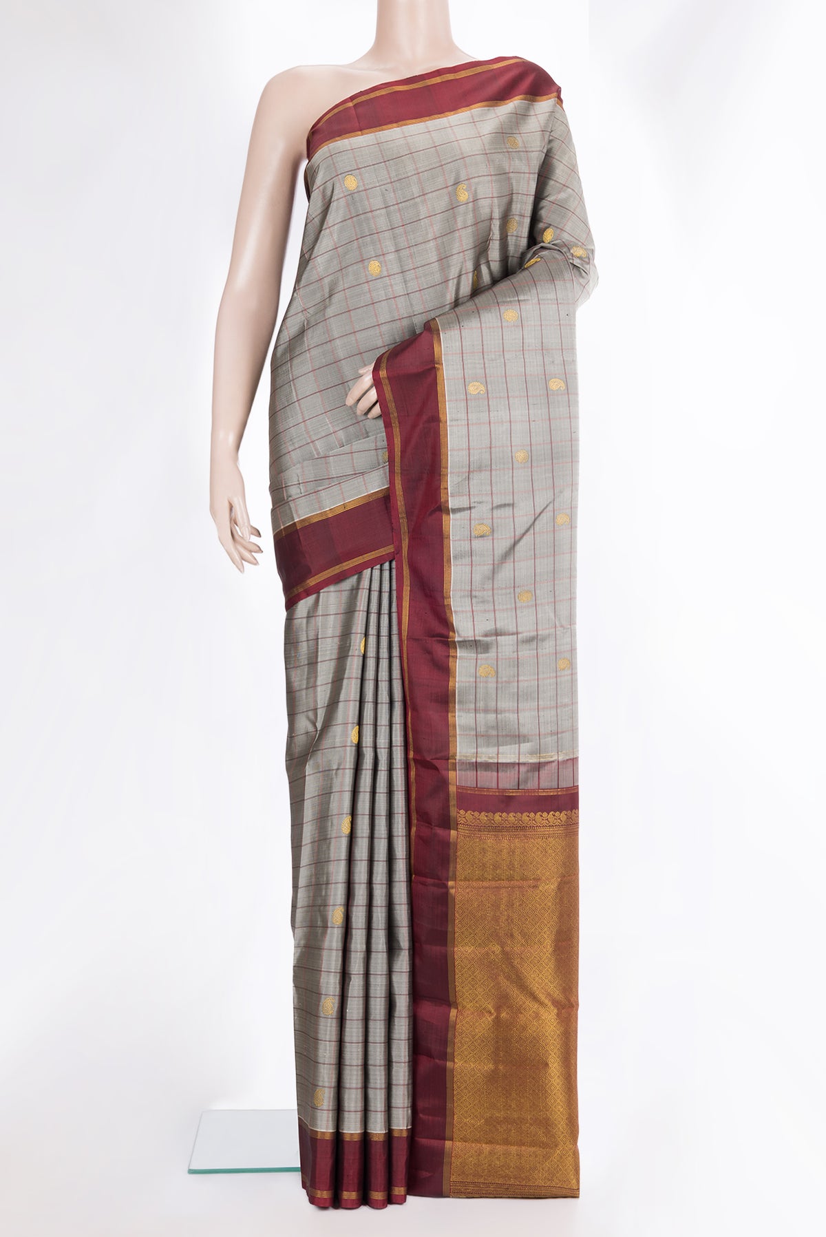 Pure Silk Grey Dual Tone Kanjivaram Saree with Checked design on the body and Zari Border.  displayed on a mannequin