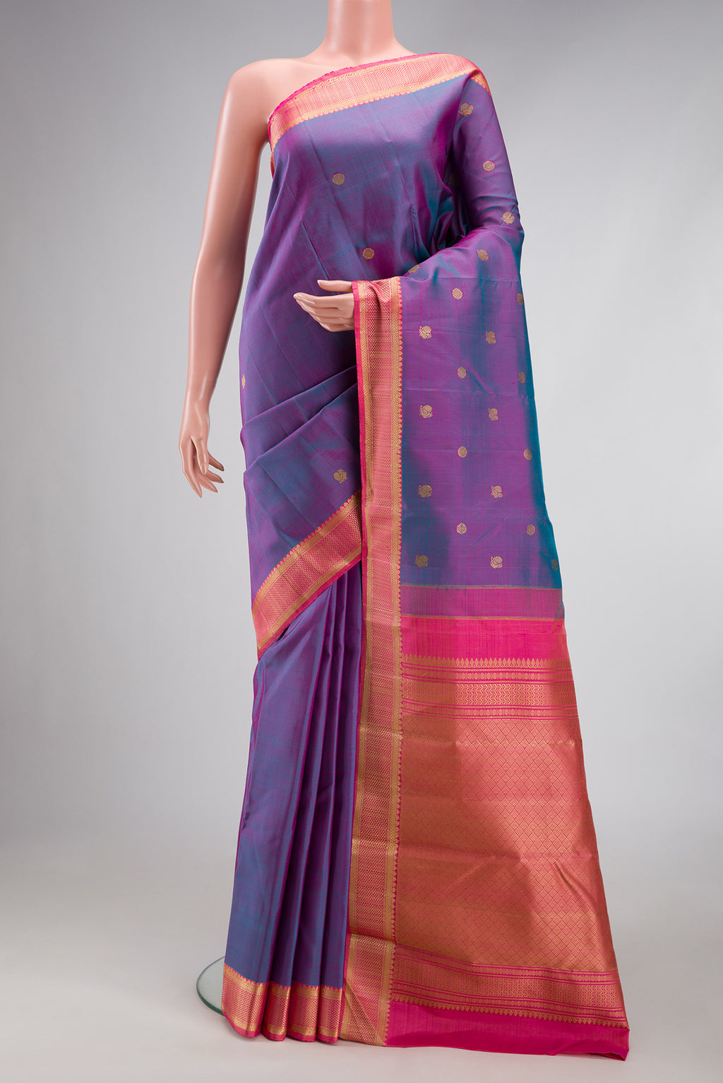 Lavender Dual Tone Kanjivaram Silk Saree with Thread Butta on the body and Thread Border.  displayed on a mannequin