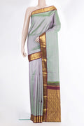 Pure Silk Pista Green Dual Tone Kanjivaram Saree with Plain Body and Zari Border.  displayed on a mannequin
