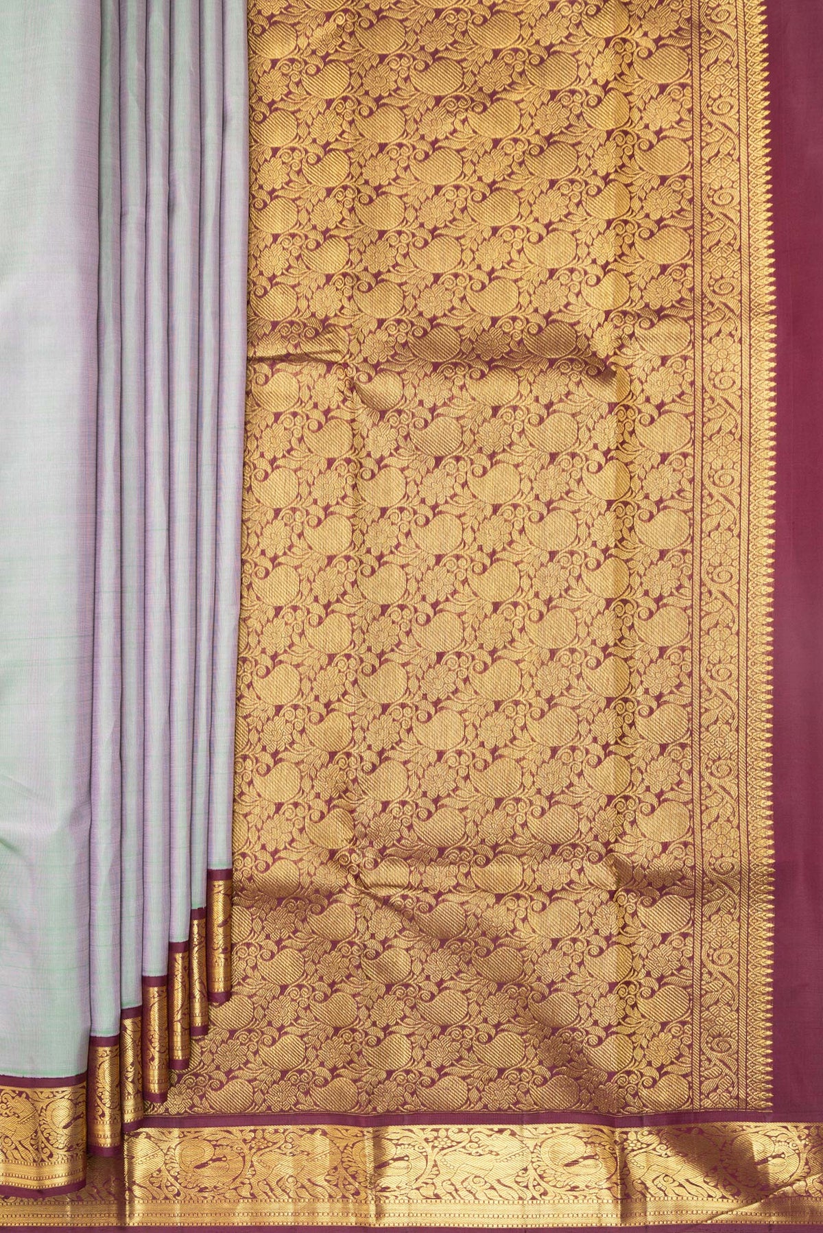 Pleats and pallu of Pure Silk Pista Green Dual Tone Kanjivaram Saree with Plain Body and Zari Border. 