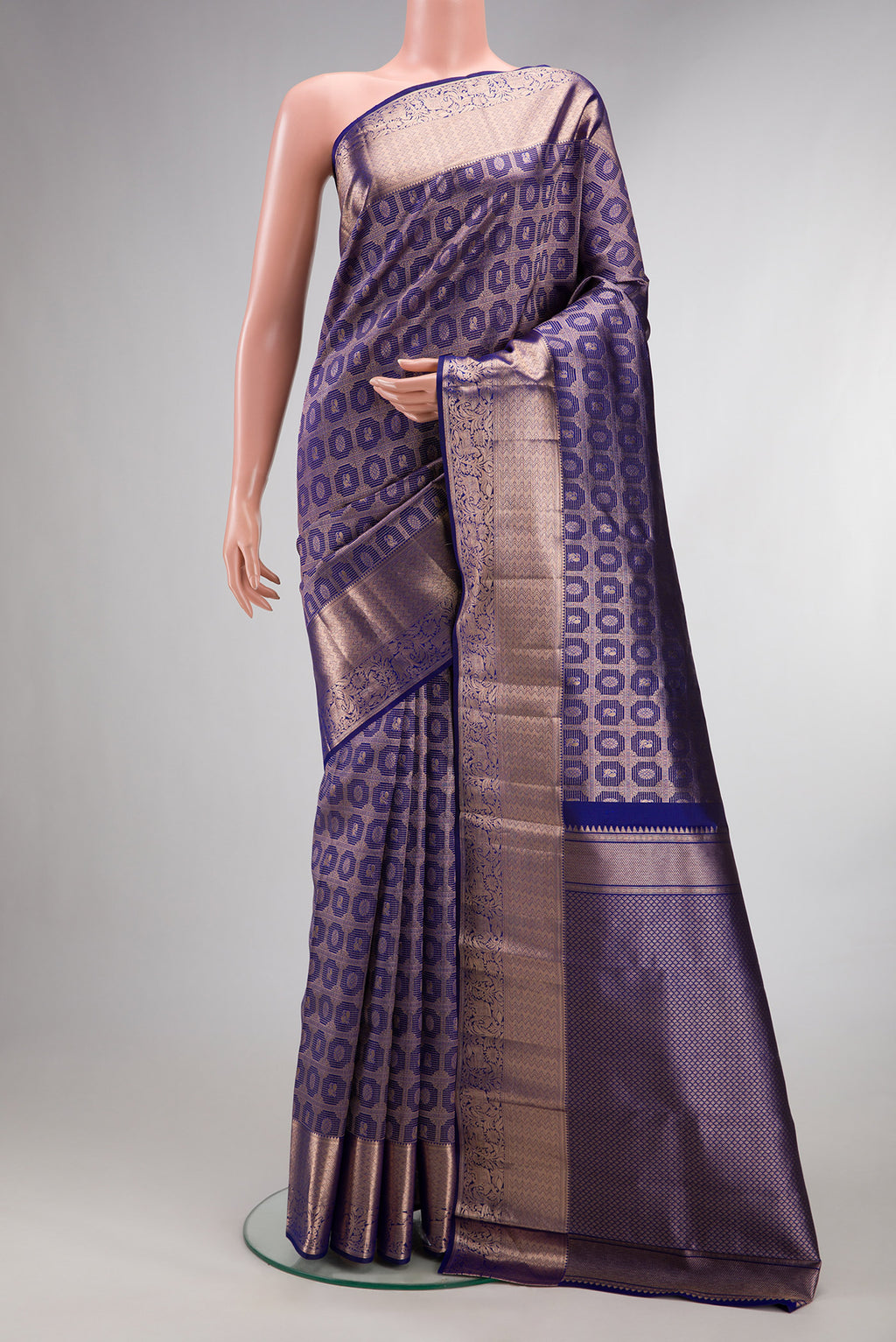 Pure Silk Dark Blue Kanchipuram Saree with Zari Brocade on the body and Zari Border.  displayed on a mannequin