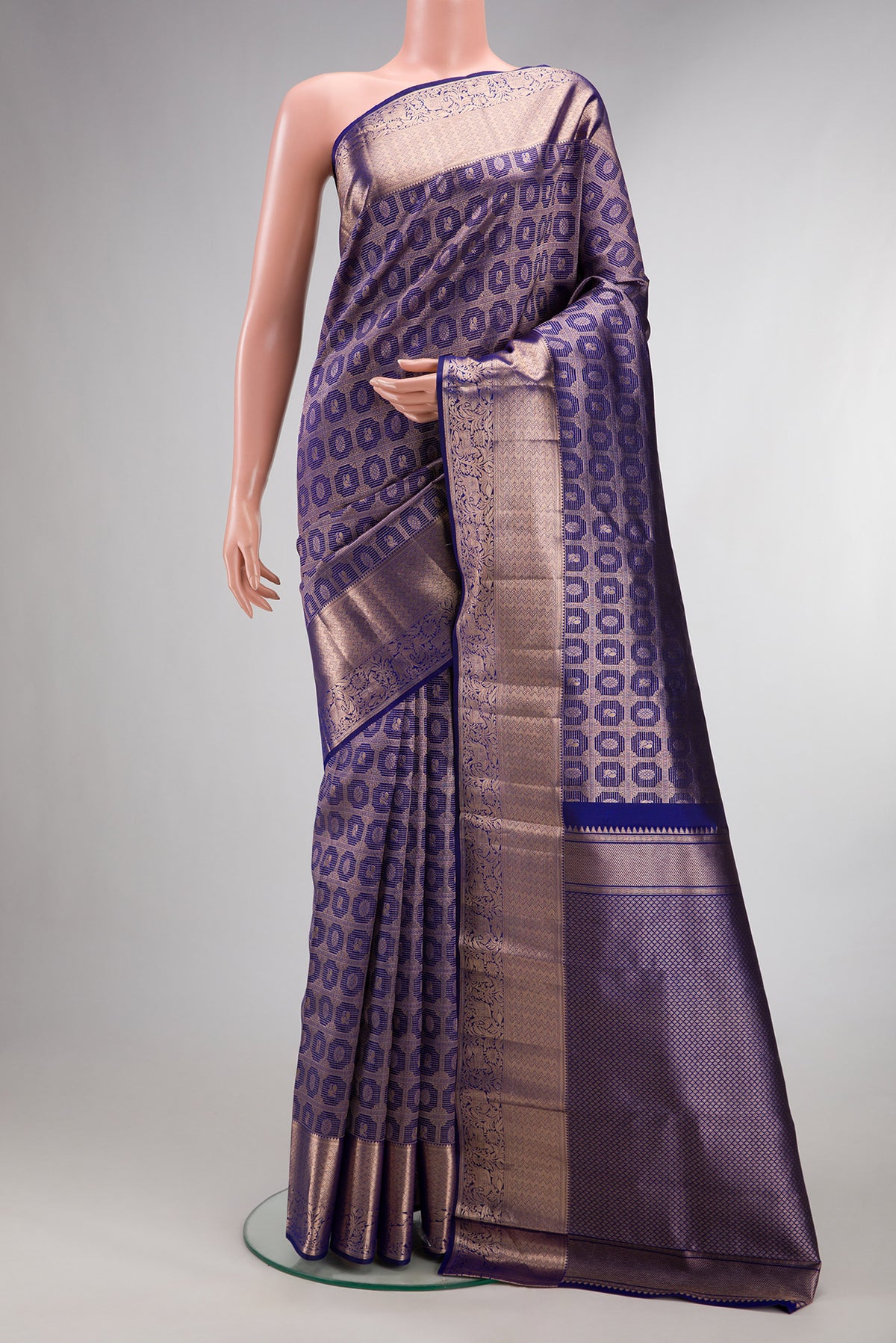 Pure Silk Dark Blue Kanchipuram Saree with Zari Brocade on the body and Zari Border.  displayed on a mannequin