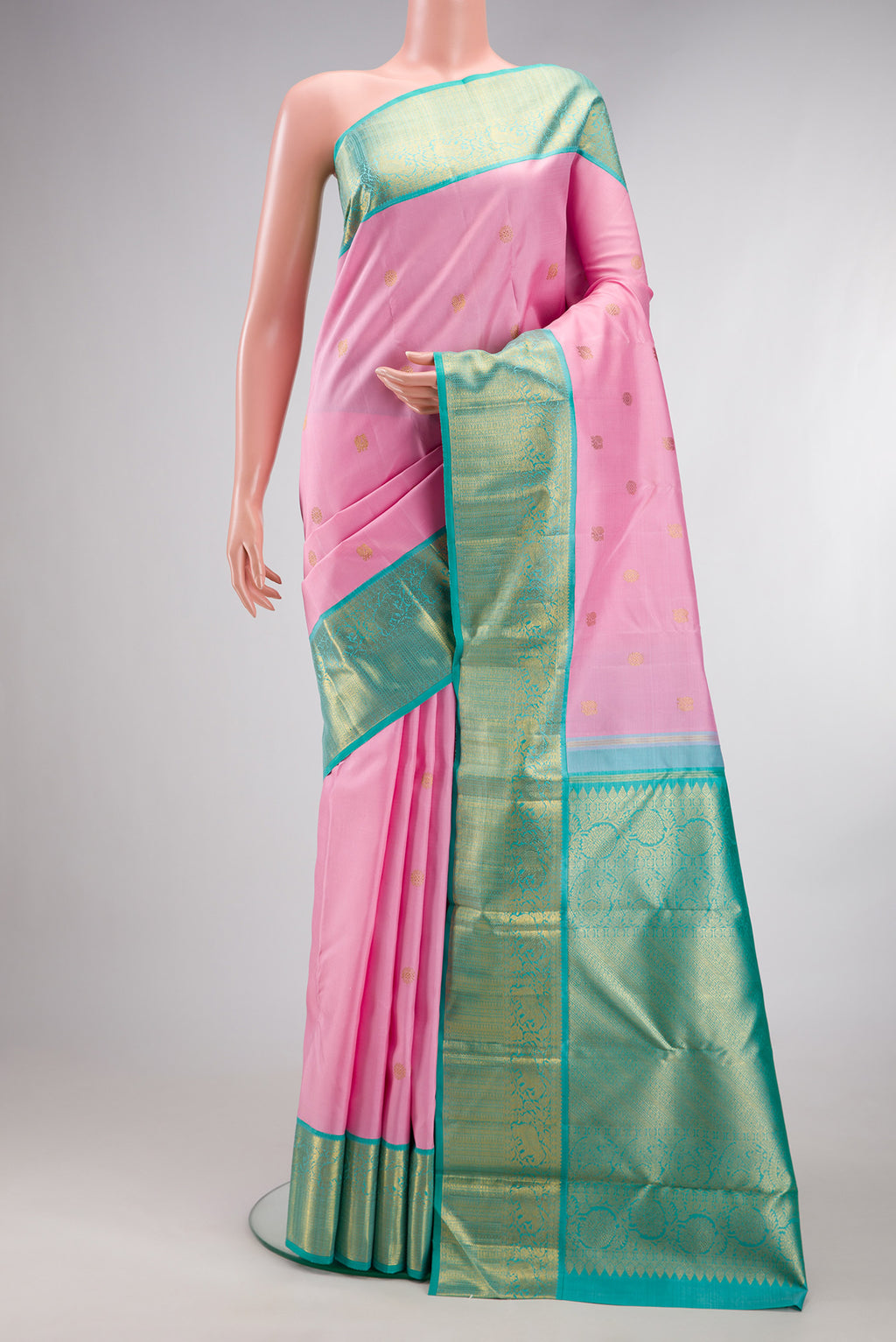 Pure Silk Pure Zari Pink Dual Tone Kanchipuram Saree with Zari Butta on the body and Zari Border.  displayed on a mannequin