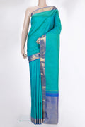 Pure Silk Sea Green Kanchipuram Saree with Jacquard design on the body and Zari Border.  displayed on a mannequin