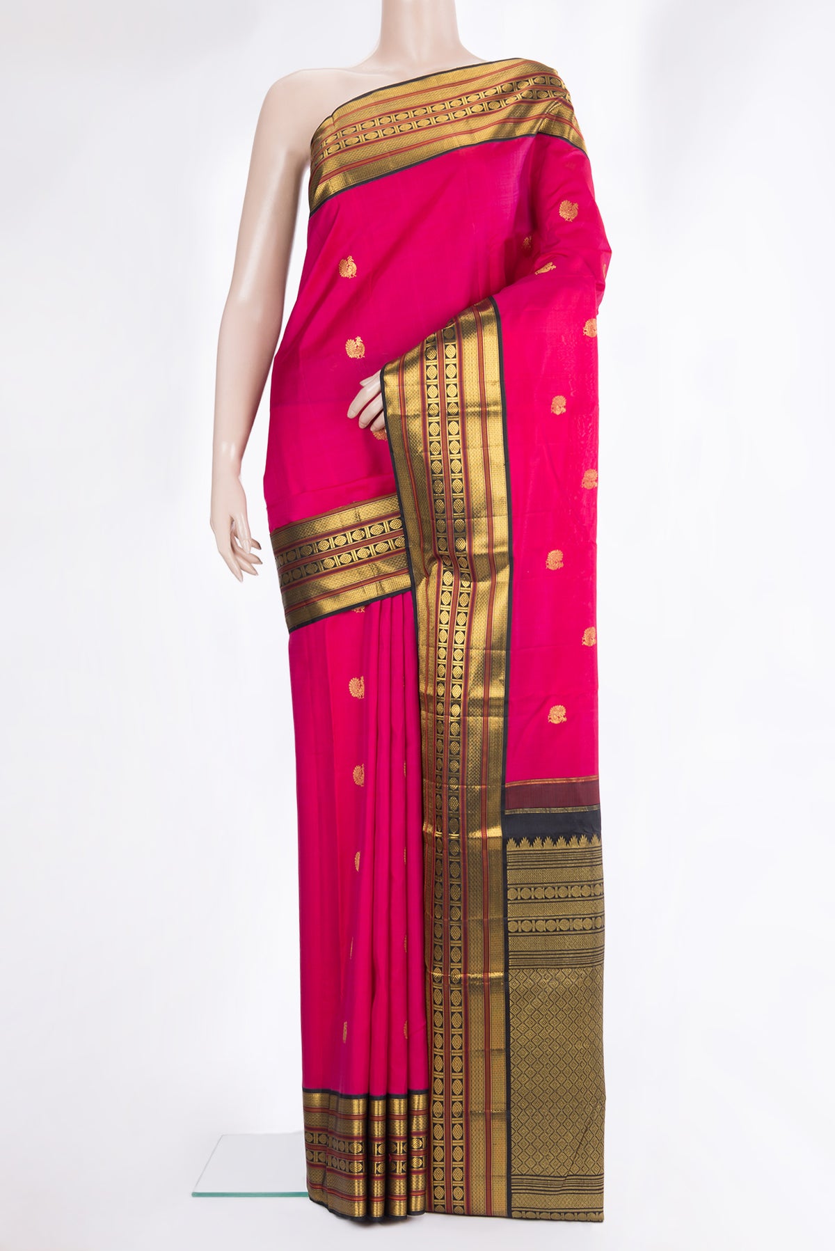 Pure Silk Dark Pink Kanjivaram Saree with Zari Butta on the body and Zari Border.  displayed on a mannequin