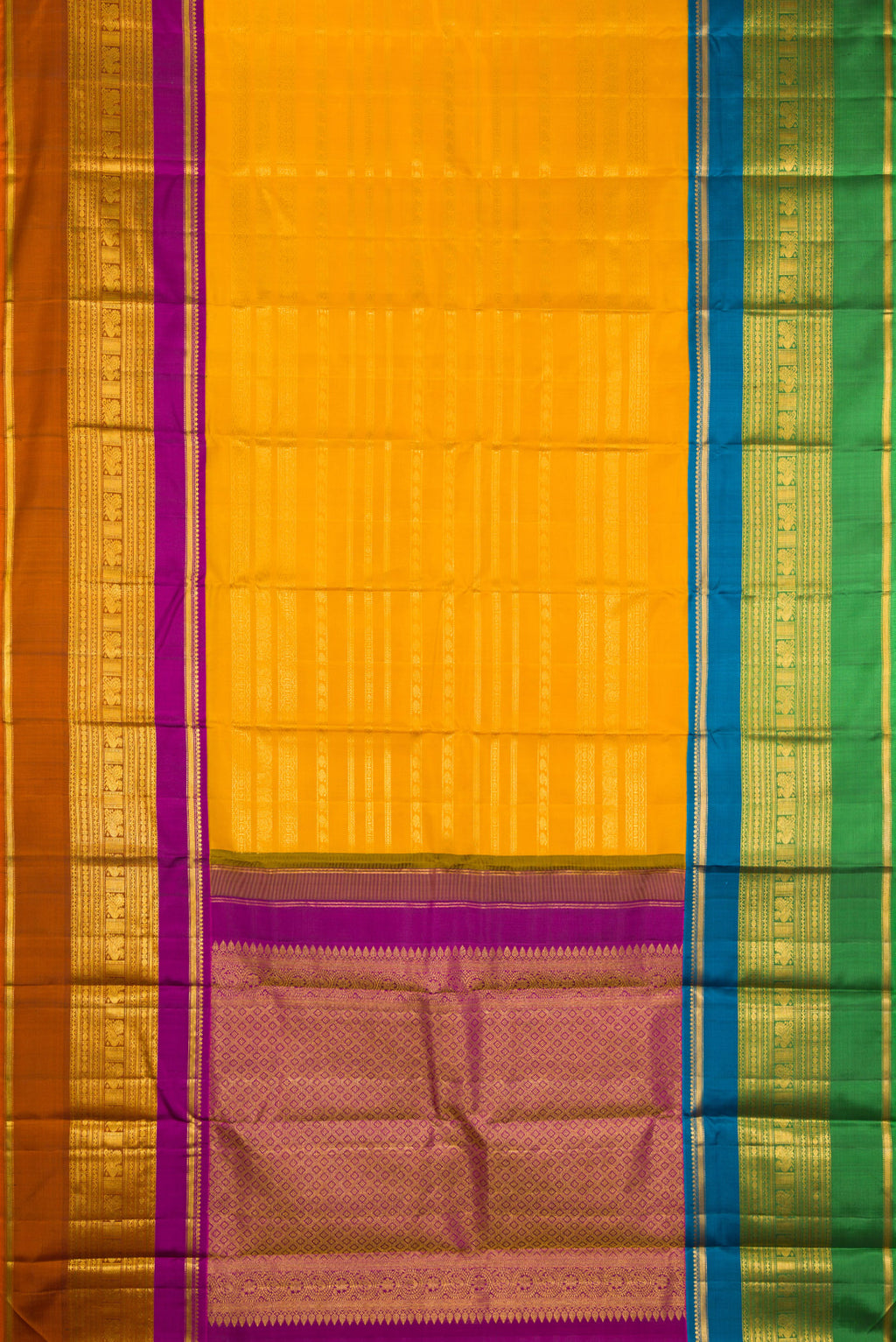 Flat view of Mustard Kanchipuram Silk Saree with Stripes on the body and Ganga Jamuna Border. 