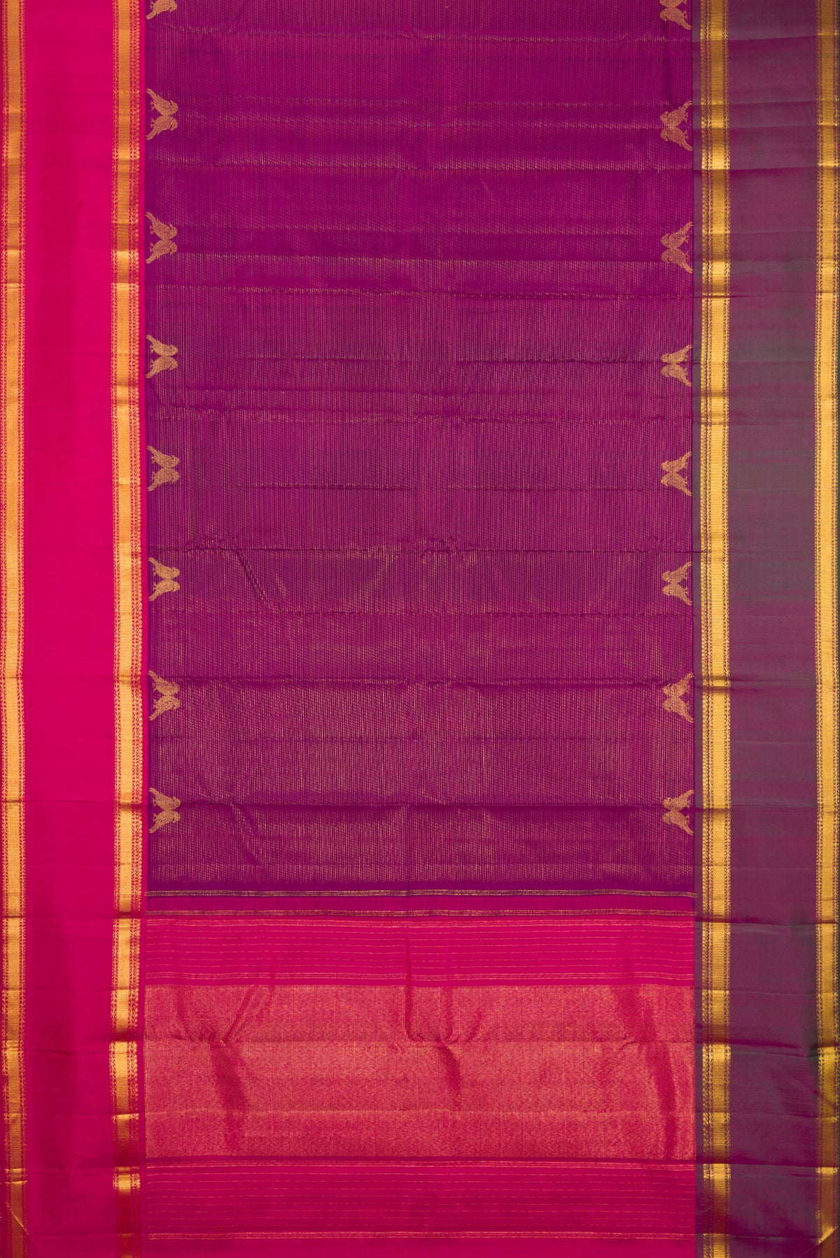 Flat view of Magenta Kanjivaram Silk Saree with Stripes on the body and Ganga Jamuna Border. 