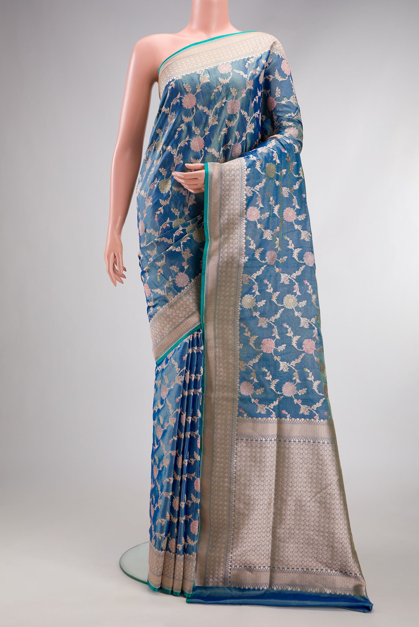 Peacock Blue Dual Tone Banarasi Silk Saree with Zari Brocade on the body and Fancy Border.  displayed on a mannequin