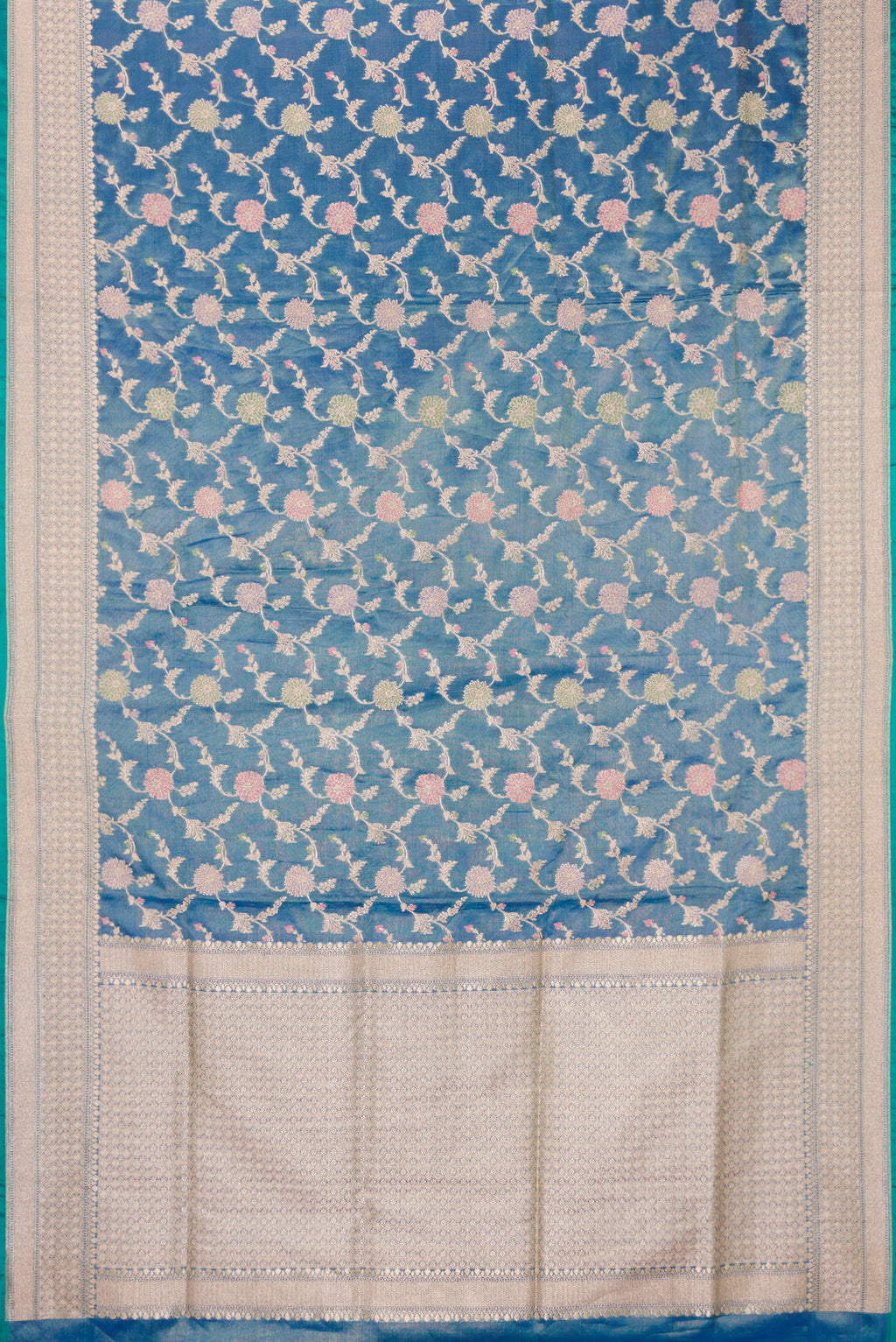 Flat view of Peacock Blue Dual Tone Banarasi Silk Saree with Zari Brocade on the body and Fancy Border. 