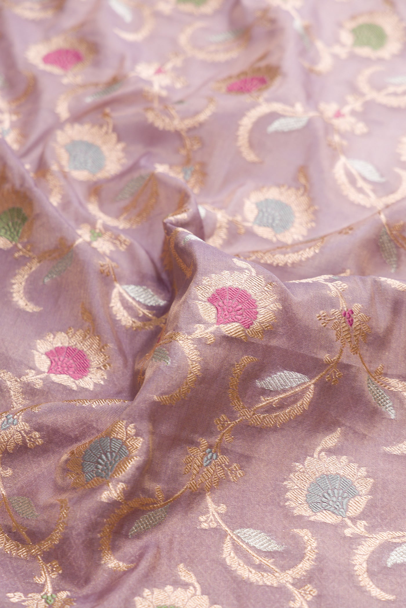 Close up of Lilac Dual Tone Banarasi Silk Saree with Zari Brocade on the body and Zari Border.  displaying folds