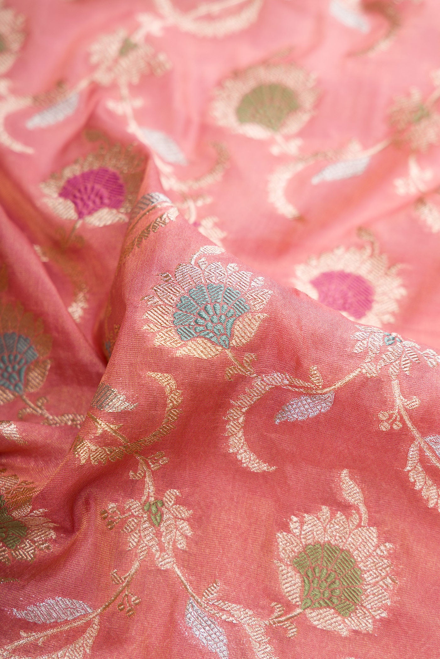 Close up of Pink Dual Tone Banarasi Silk Saree with Zari Brocade on the body and Fancy Border.  displaying folds