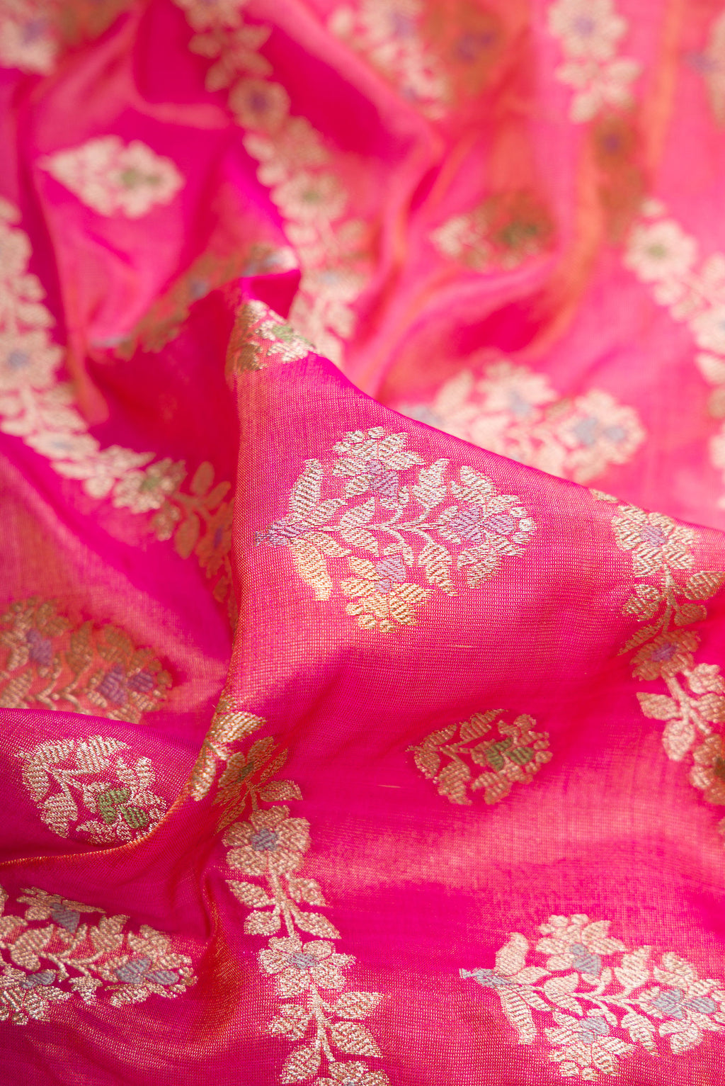Close up of Pink Dual Tone Banarasi Silk Saree with Zari Brocade on the body and Fancy Border.  displaying folds