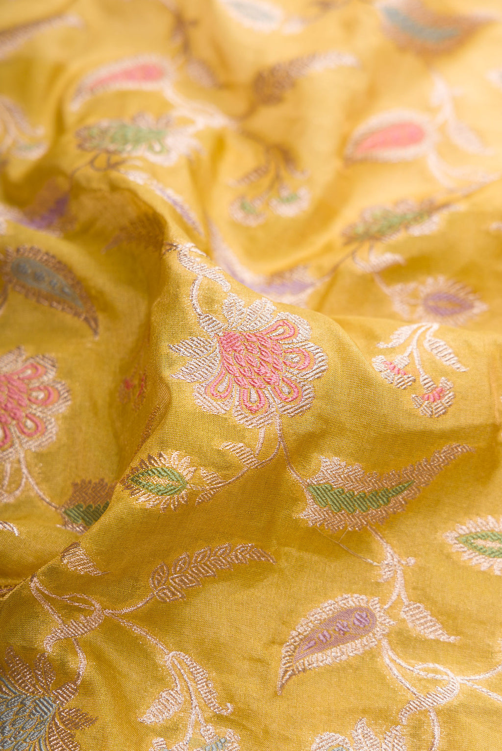 Close up of Mehandi Green Dual Tone Banarasi Silk Saree with Zari Brocade on the body and Fancy Border.  displaying folds