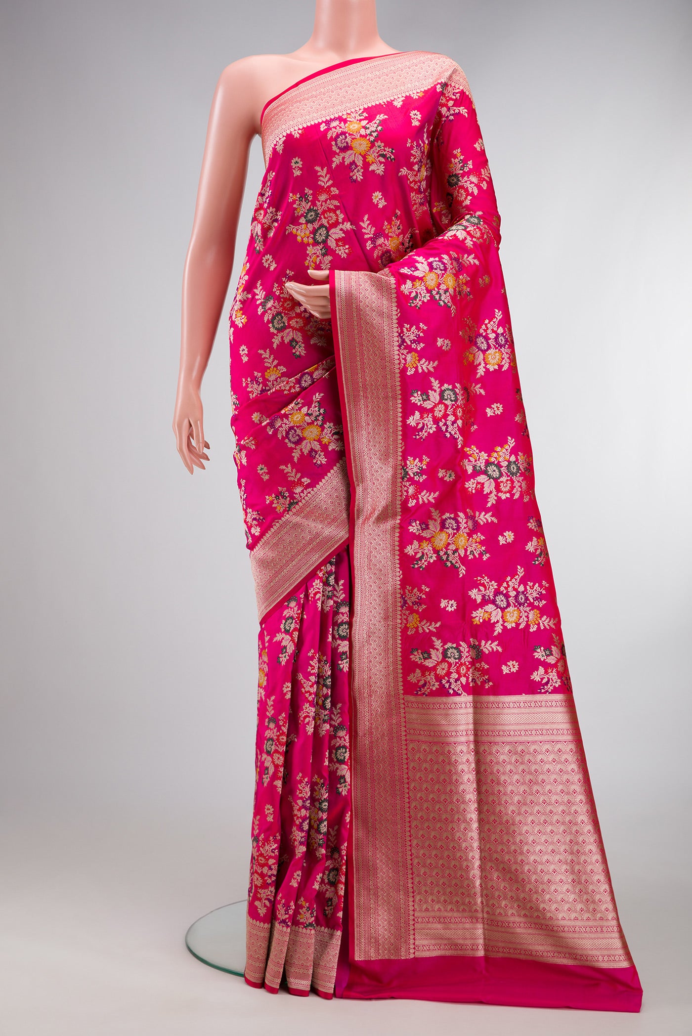 Dark Pink Banarasi Silk Saree with Zari Brocade on the body and Zari Border.  displayed on a mannequin