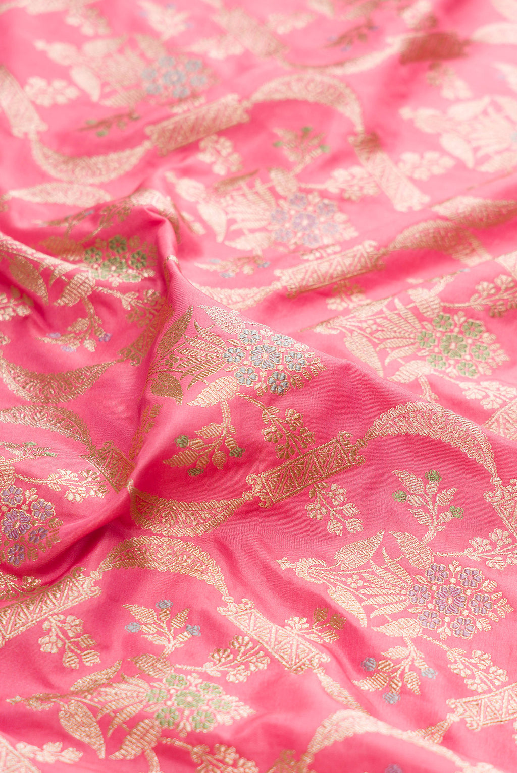 Close up of Pink Dual Tone Banarasi Silk Saree with Zari Brocade on the body and Zari Border.  displaying folds