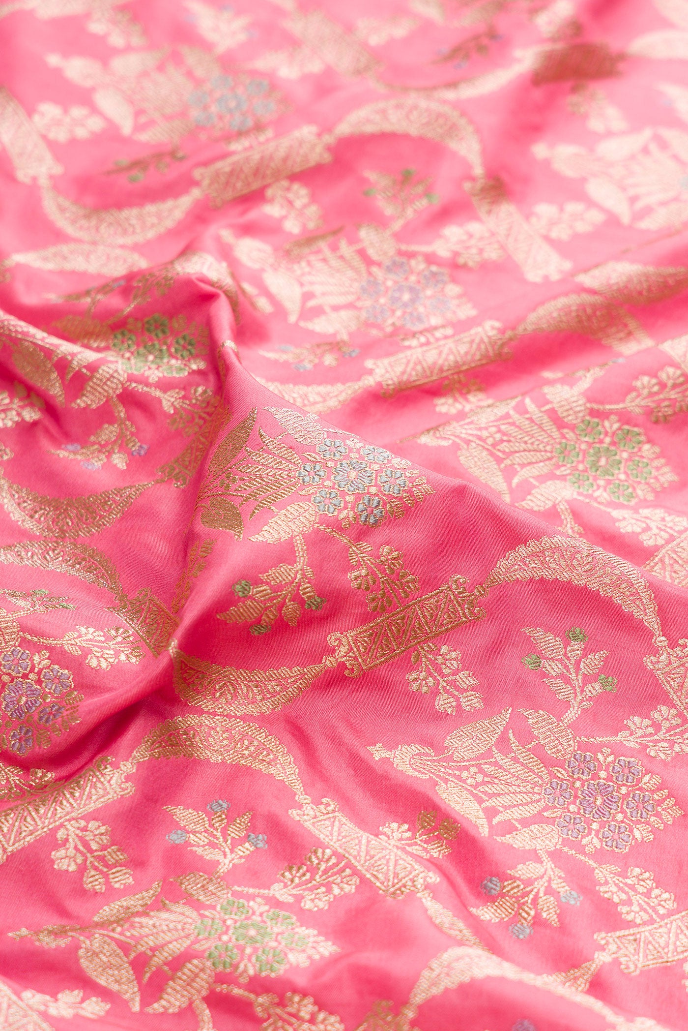 Close up of Pink Dual Tone Banarasi Silk Saree with Zari Brocade on the body and Zari Border.  displaying folds