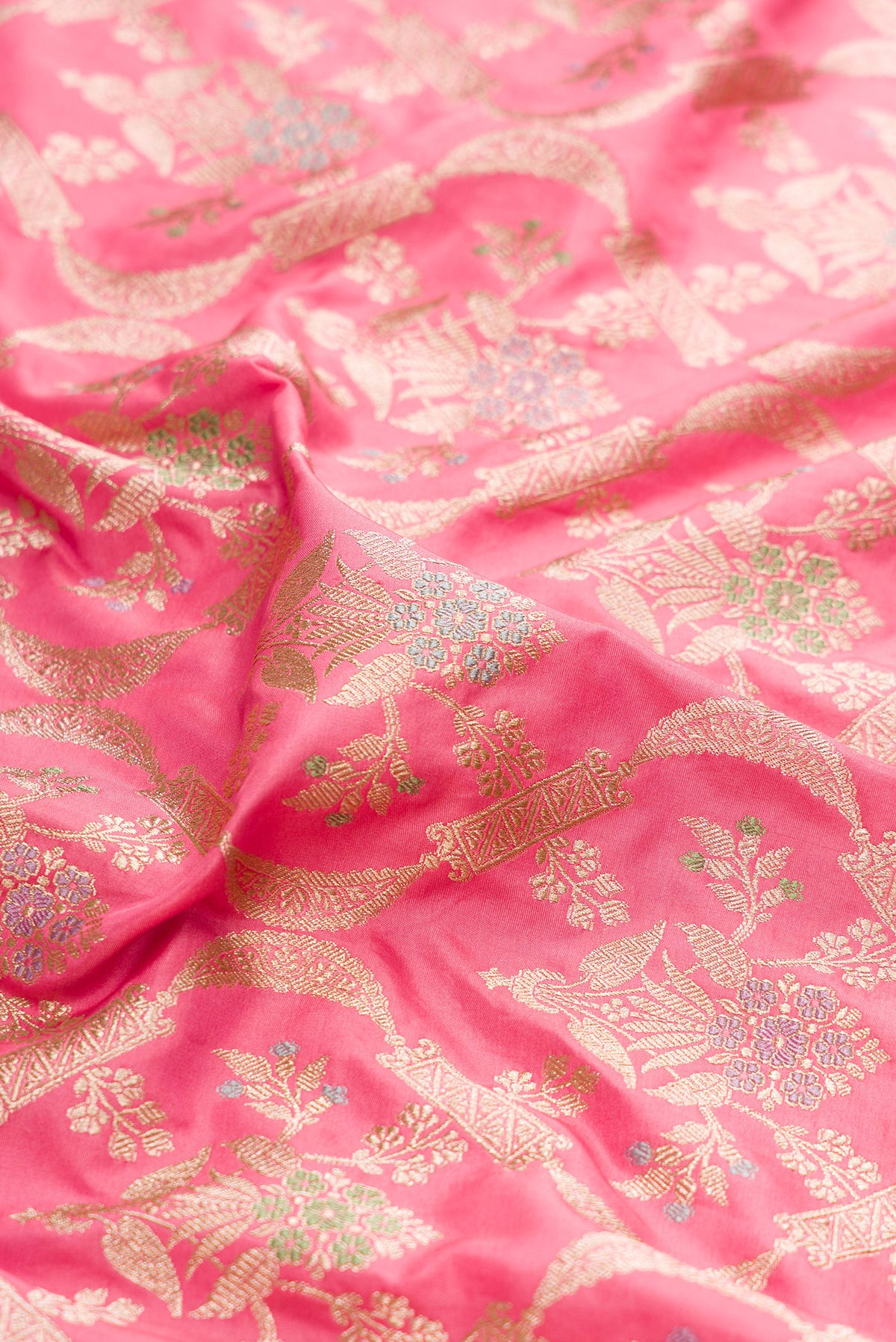 Close up of Pink Dual Tone Banarasi Silk Saree with Zari Brocade on the body and Zari Border.  displaying folds