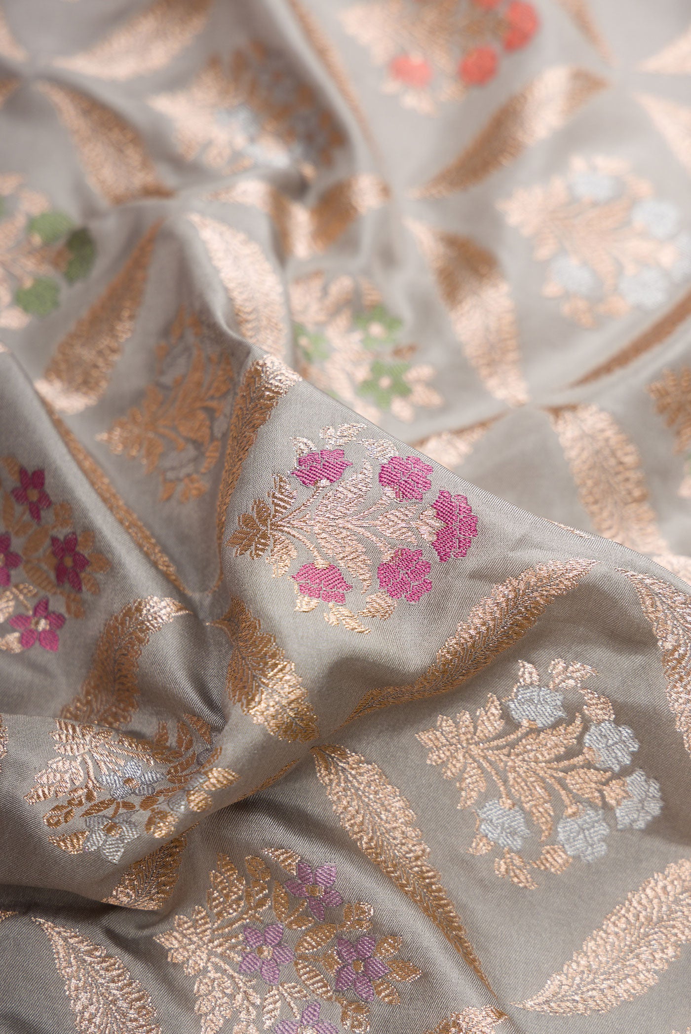 Close up of Grey Dual Tone Banarasi Silk Saree with Zari Brocade on the body and Fancy Border.  displaying folds