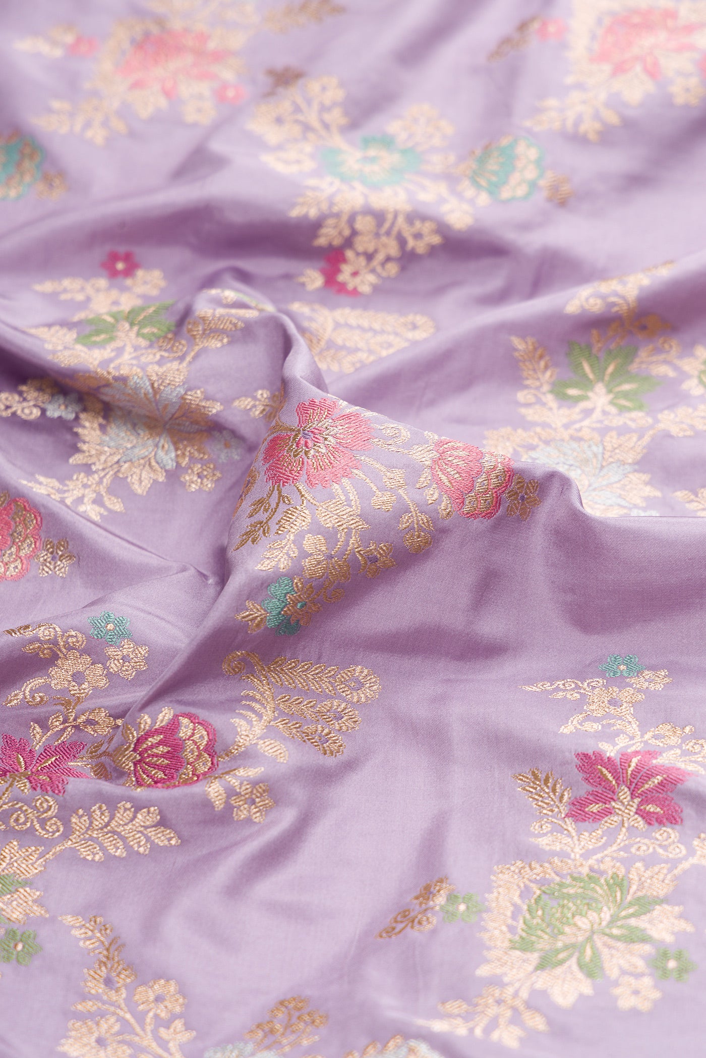 Close up of Lavender Dual Tone Banarasi Silk Saree with Zari Brocade on the body and Zari Border.  displaying folds
