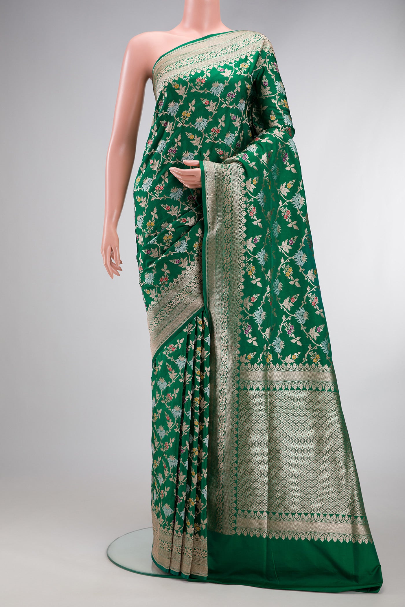 Green Banarasi Silk Saree with Zari Brocade on the body and Zari Border.  displayed on a mannequin