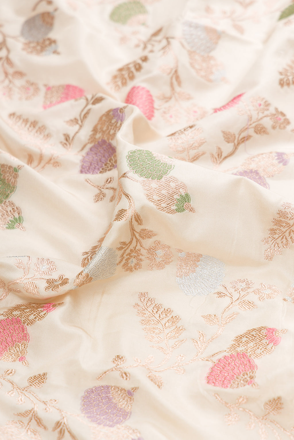Close up of Cream Banarasi Silk Saree with Zari Brocade on the body and Zari Border.  displaying folds