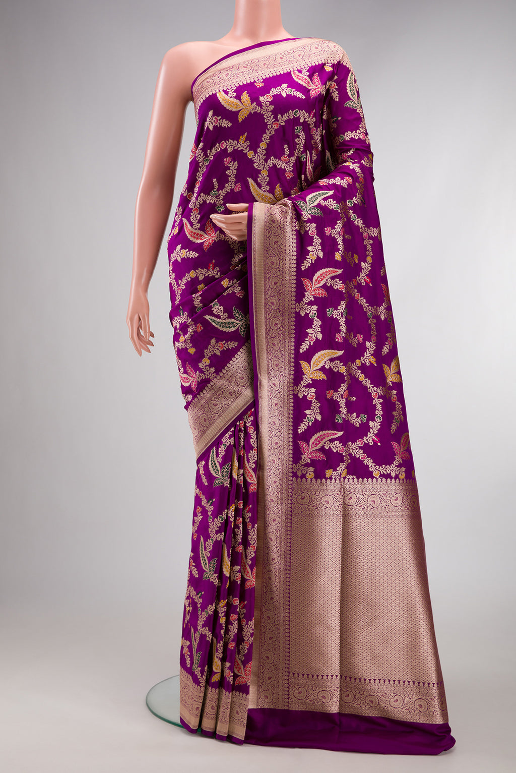 Purple Banarasi Silk Saree with Zari Brocade on the body and Fancy Border.  displayed on a mannequin