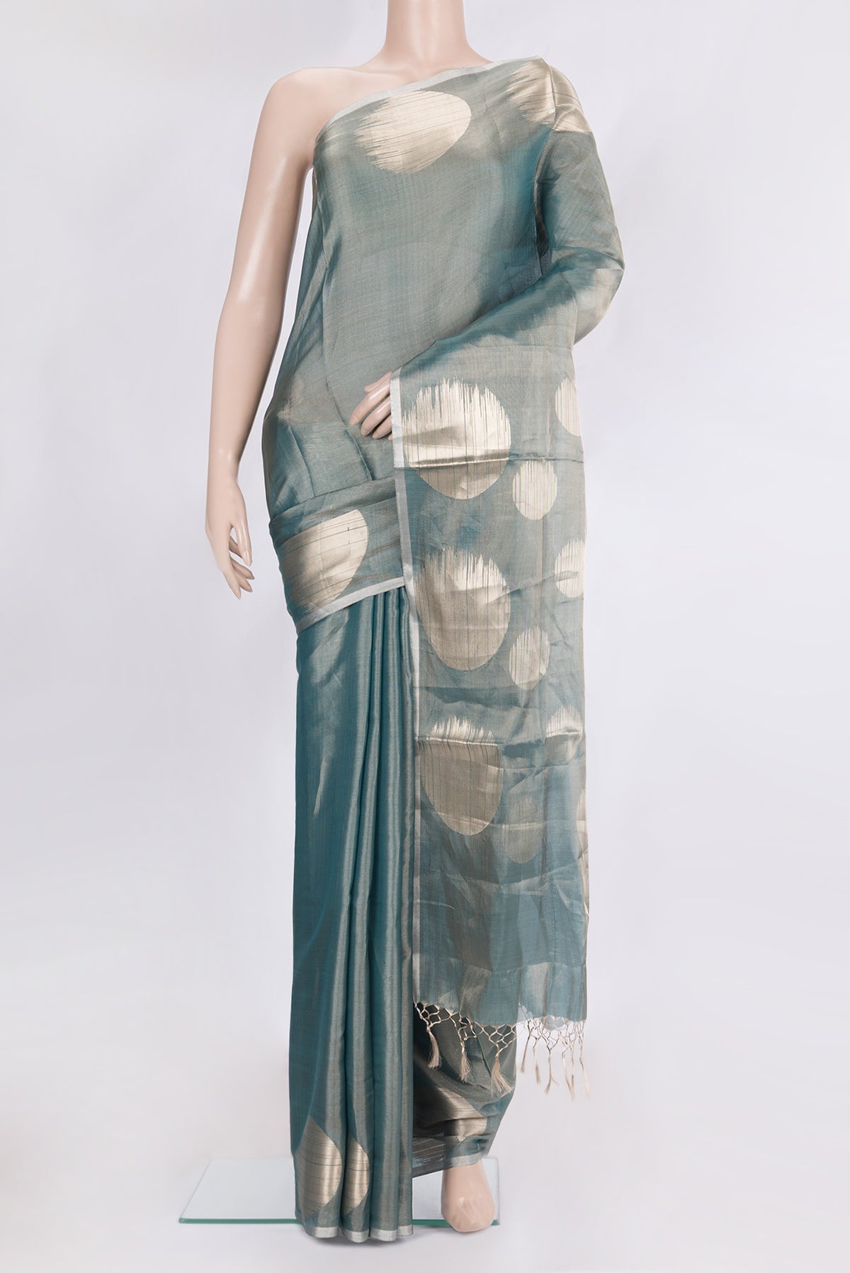 Green Organza Saree with Plain Body and Without Border.  displayed on a mannequin