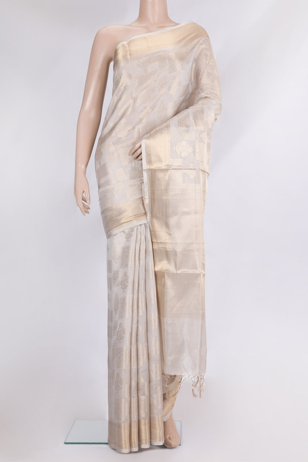Pure Silk Beige Dual Tone Kanjivaram Saree with Zari Brocade on the body and Zari Border.  displayed on a mannequin