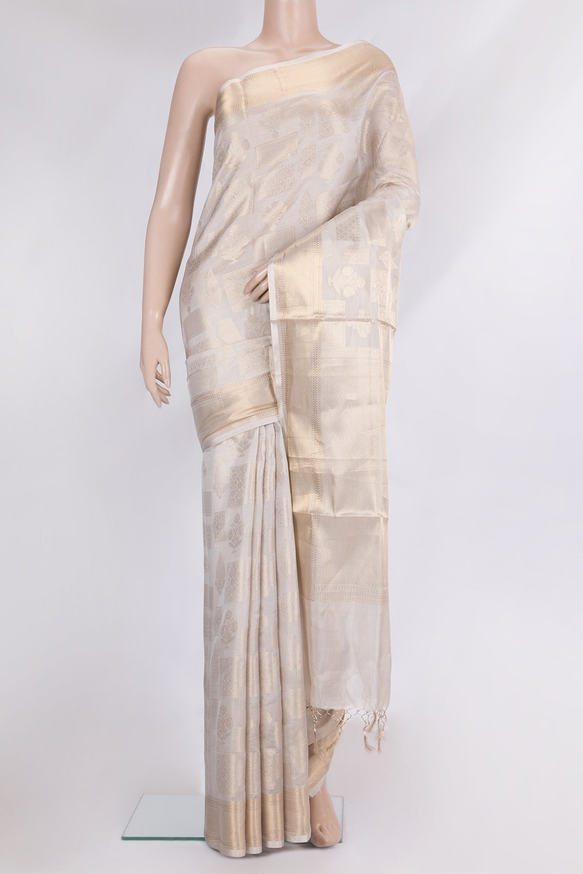 Pure Silk Beige Dual Tone Kanjivaram Saree with Zari Brocade on the body and Zari Border.  displayed on a mannequin