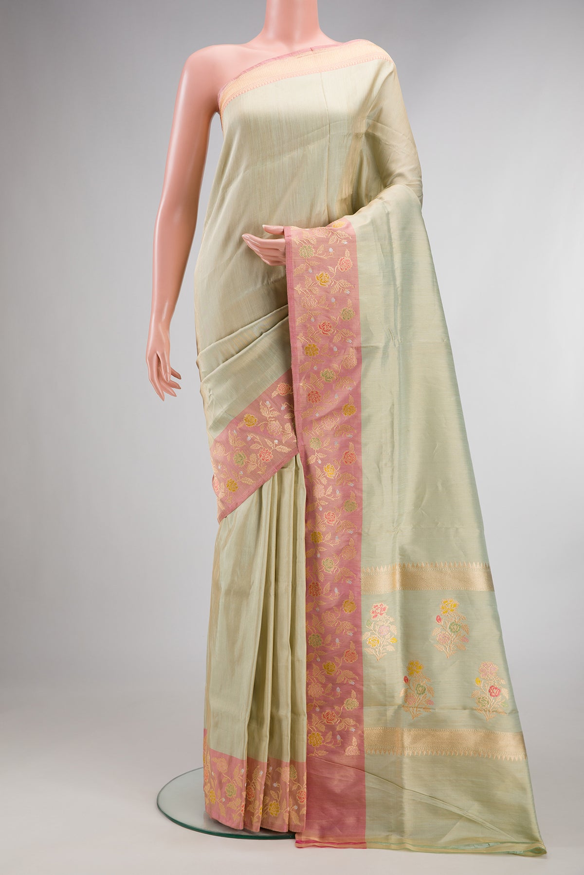 Pista Green Dual Tone Banarasi Tissue Saree with Plain Body and Fancy Border.  displayed on a mannequin