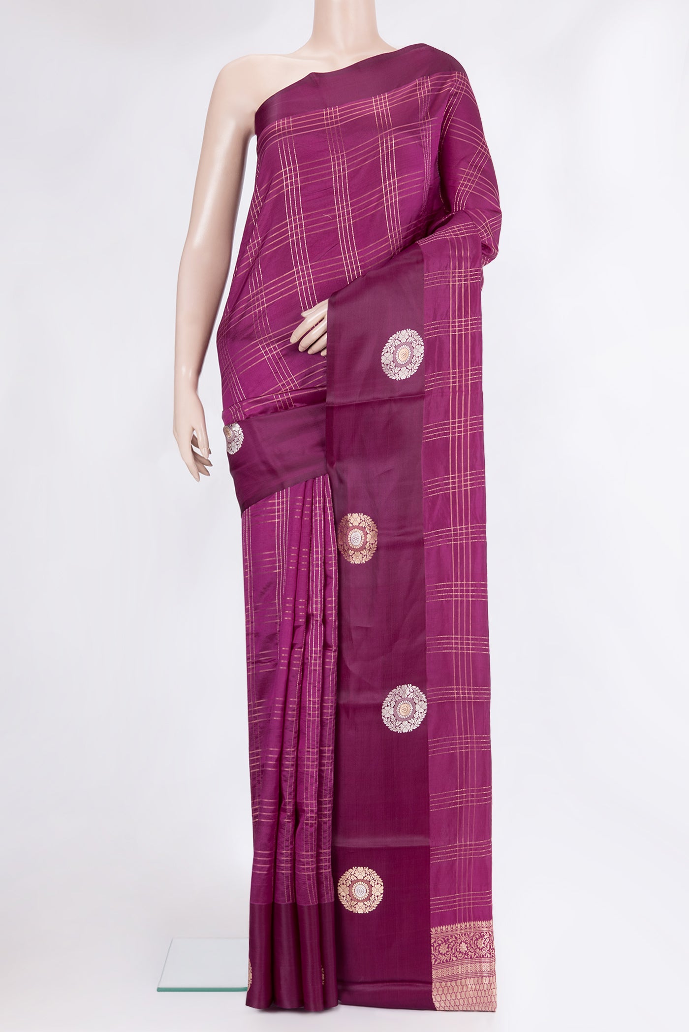 Purple Tussar Silk Saree with Checked design on the body and Fancy Border.  displayed on a mannequin