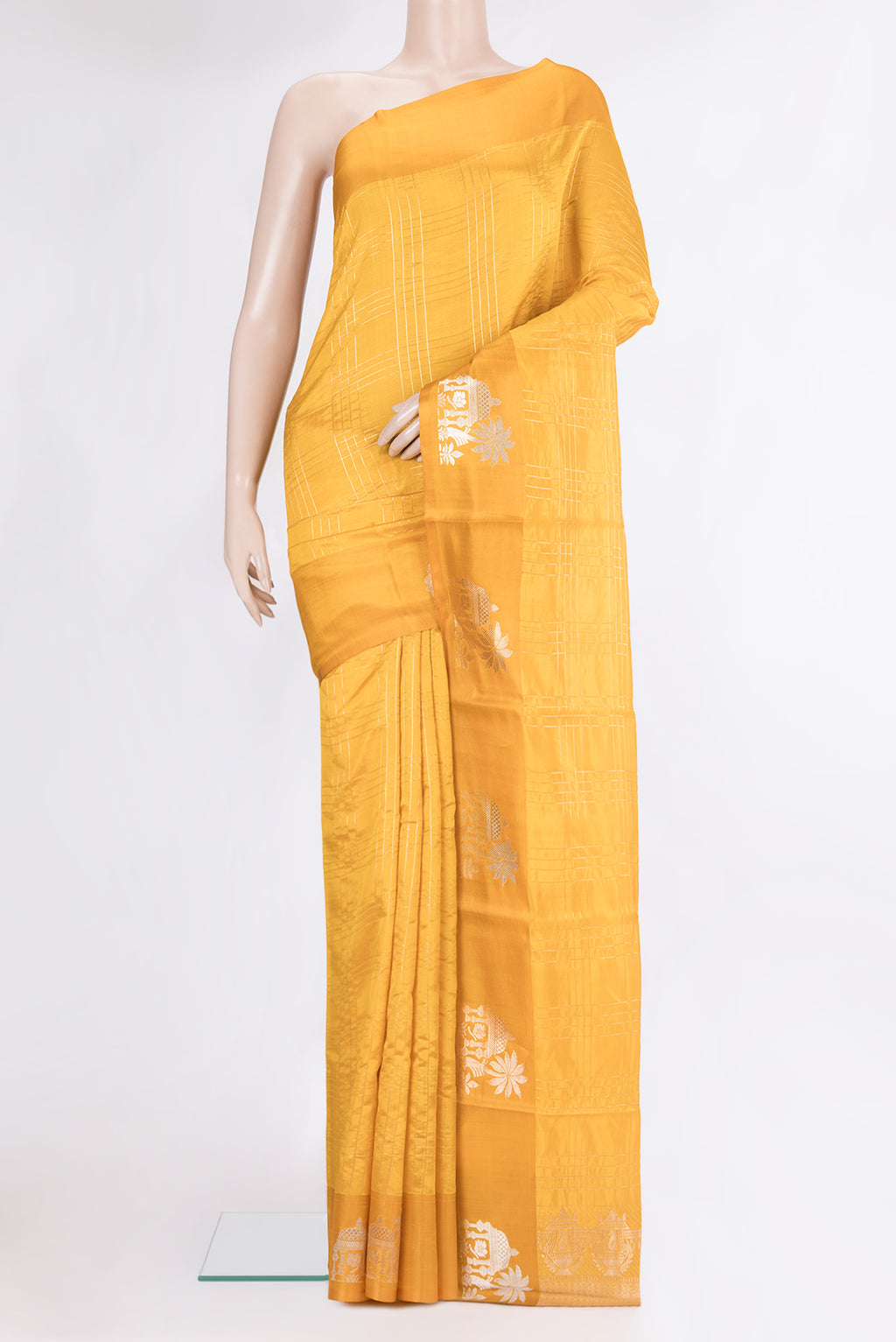 Yellow Tussar Silk Saree with Checked design on the body and Fancy Border.  displayed on a mannequin