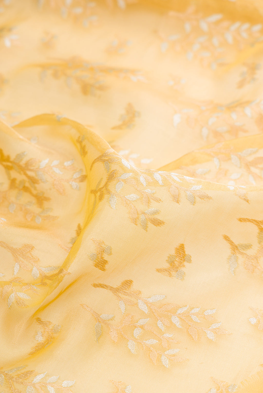 Close up of Yellow Dual Tone Banarasi Kota Silk Saree with Zari Brocade on the body and Zari Border.  displaying folds