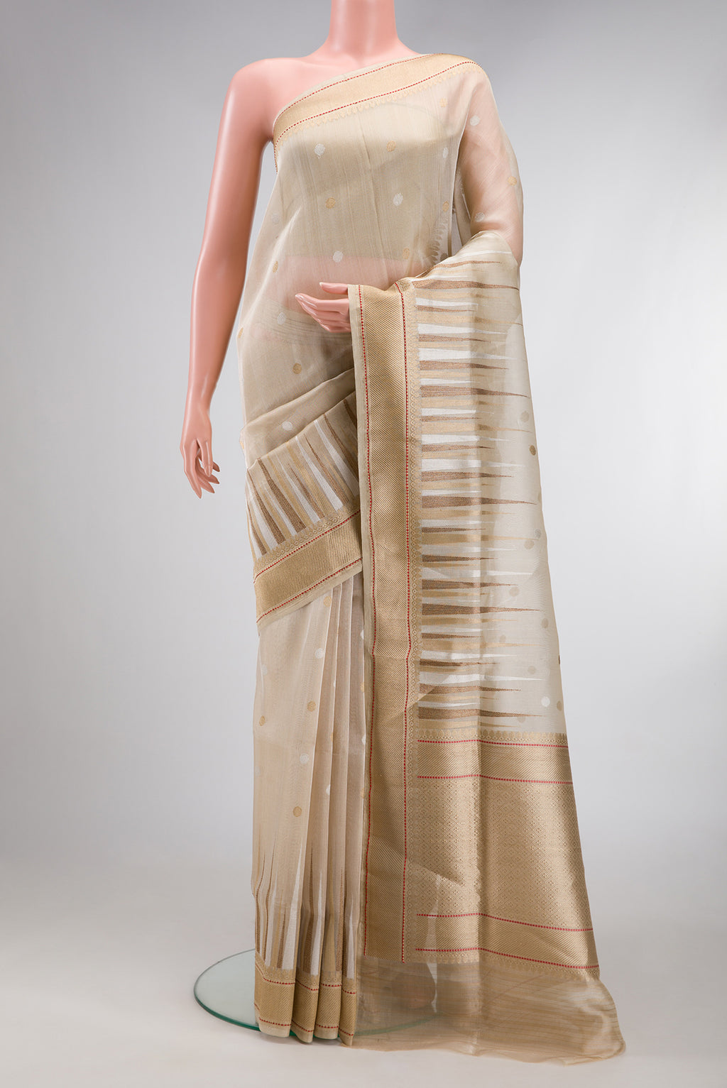 Cream Dual Tone Banarasi Silk Saree with Zari Brocade on the body and Zari Border.  displayed on a mannequin