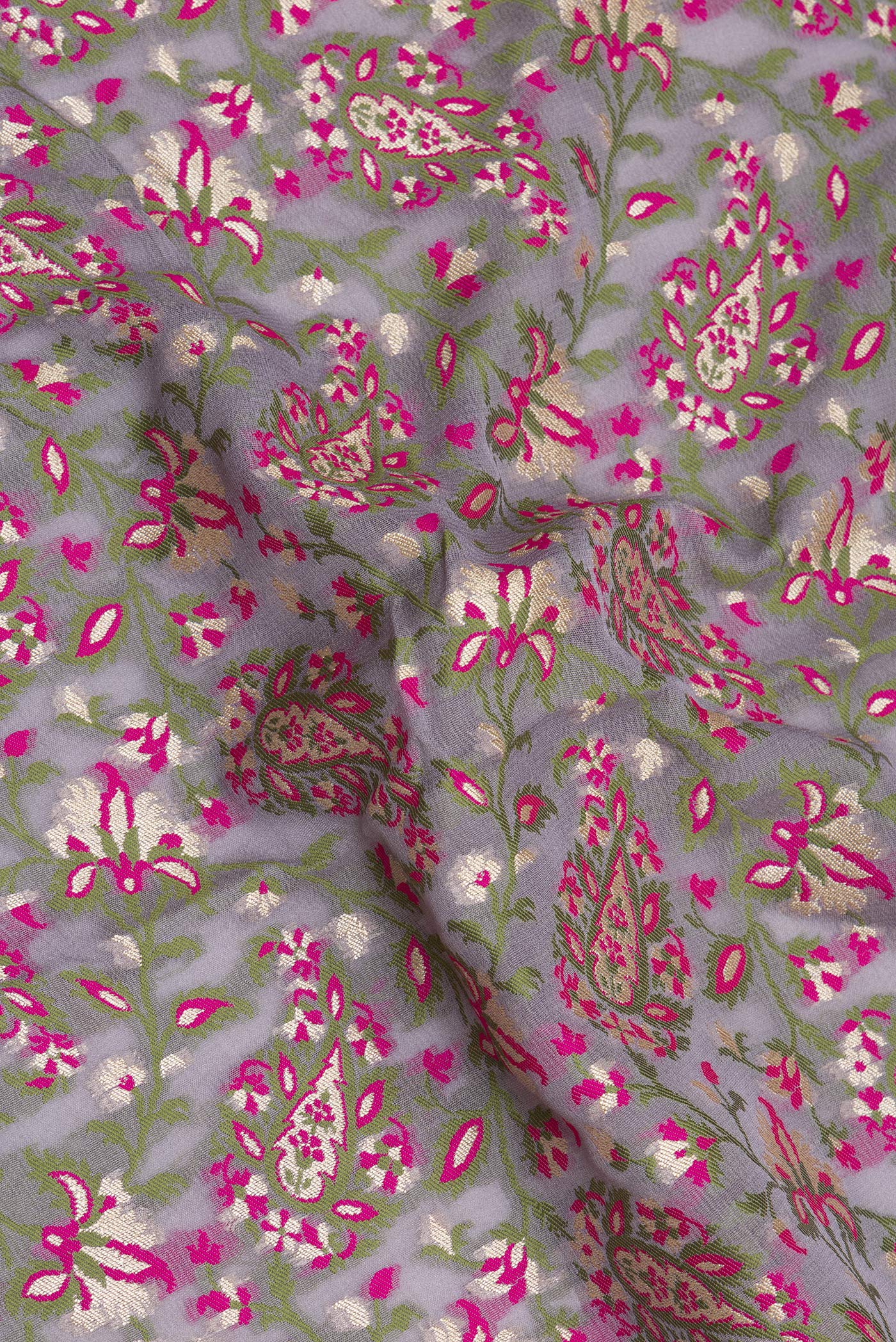 Close up of Grey Banarasi Georgette Saree with Thread Brocade on the body and Thread Border.  displaying folds