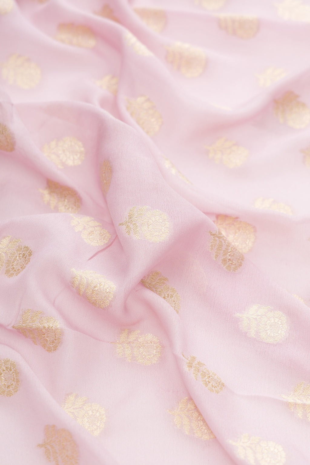Close up of Lilac Banarasi Georgette Saree with Zari Butta on the body and Fancy Border.  displaying folds