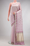 Lilac Banarasi Georgette Saree with Zari Butta on the body and Fancy Border.  displayed on a mannequin