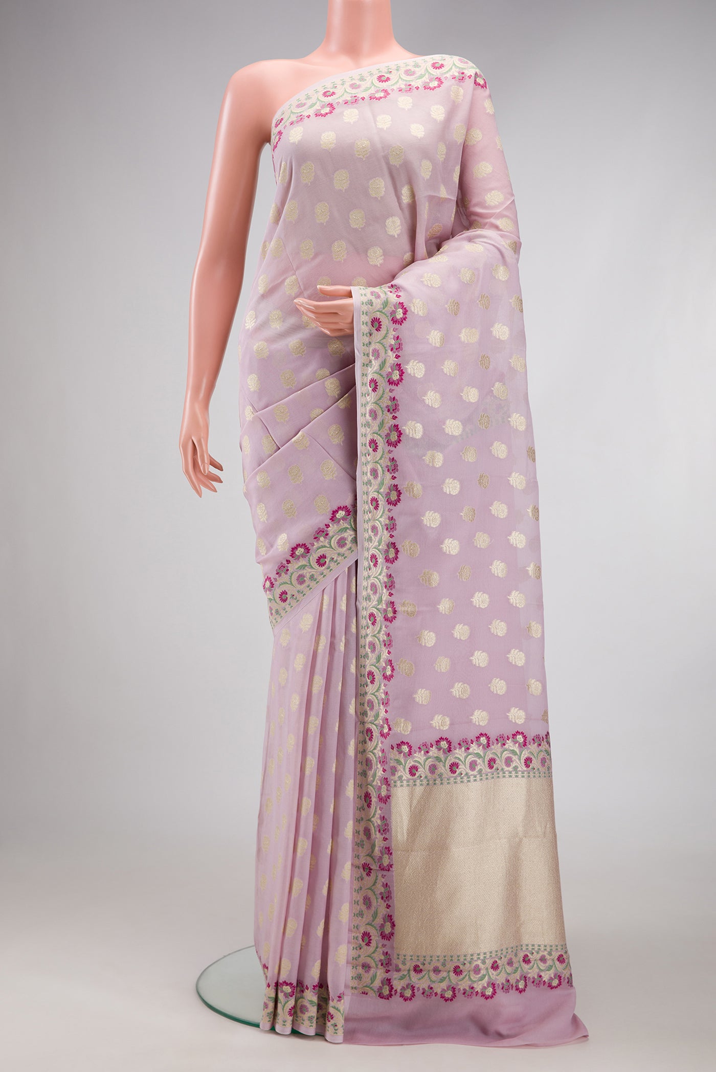 Lilac Banarasi Georgette Saree with Zari Butta on the body and Fancy Border.  displayed on a mannequin