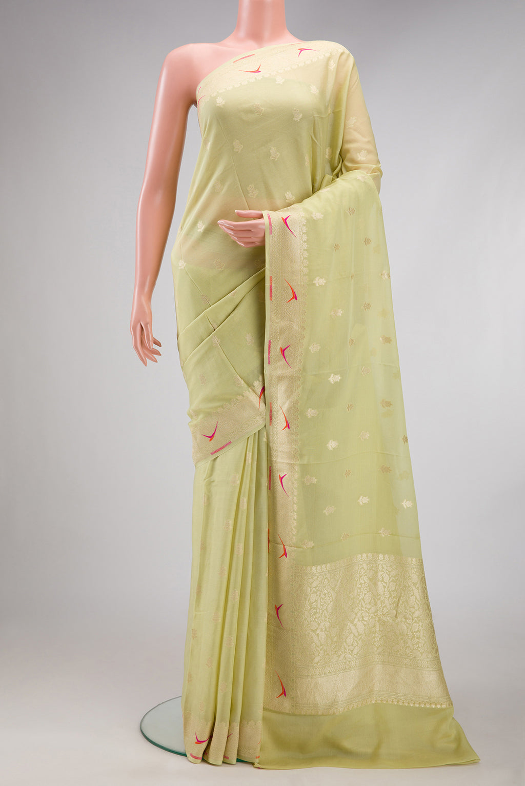 Pista Green Banarasi Georgette Saree with Zari Butta on the body and Fancy Border.  displayed on a mannequin