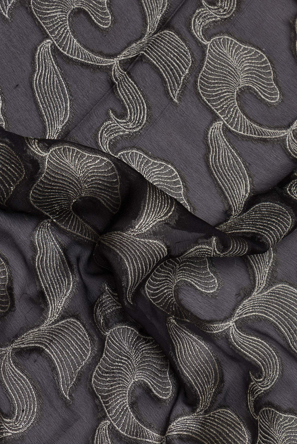 Close up of Black Banarasi Georgette Saree with Zari Brocade on the body and Zari Border.  displaying folds