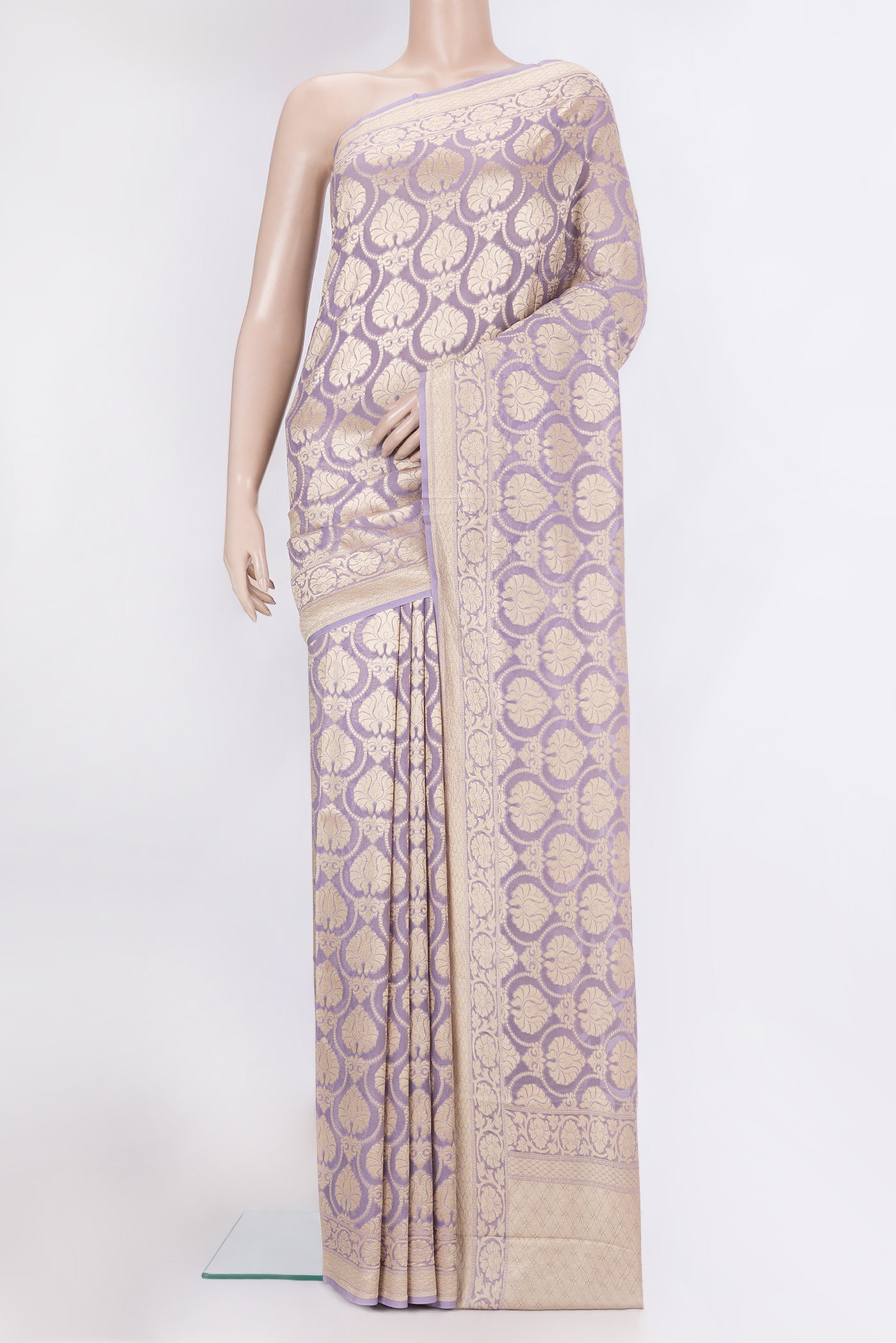 Lavender Banarasi Georgette Saree with Zari Brocade on the body and Zari Border.  displayed on a mannequin