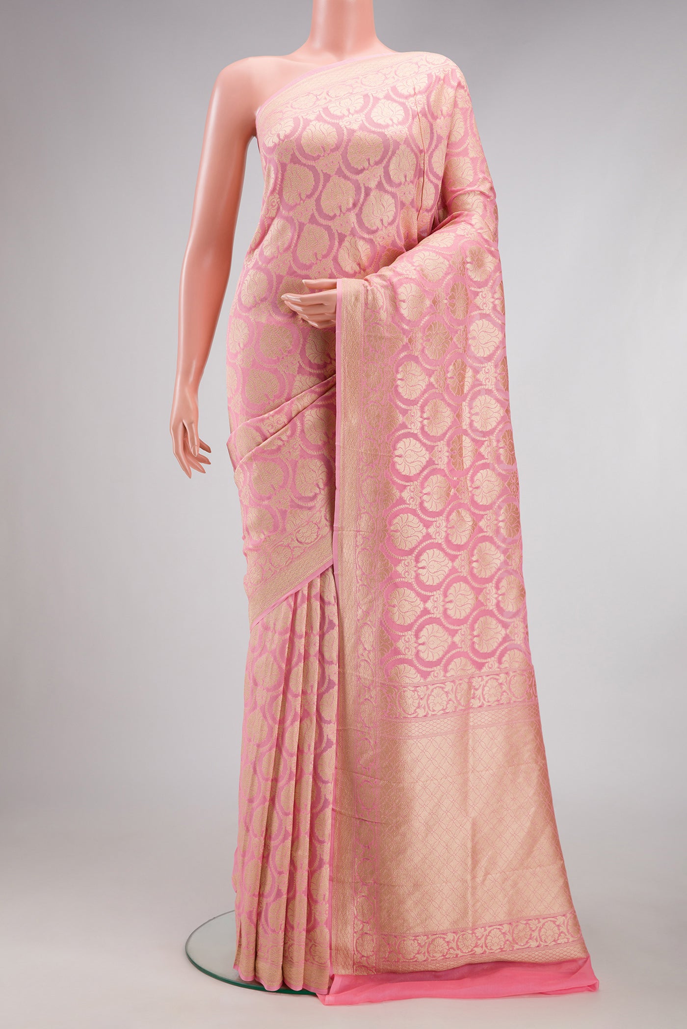 Pink Banarasi Georgette Saree with Zari Brocade on the body and Fancy Border.  displayed on a mannequin