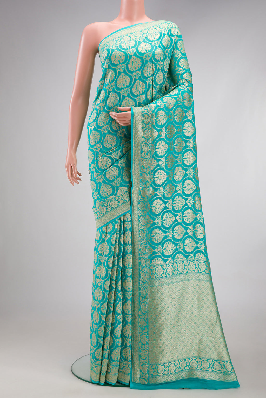 Sky Blue Banarasi Georgette Saree with Zari Brocade on the body and Fancy Border.  displayed on a mannequin