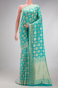 Sky Blue Banarasi Georgette Saree with Zari Brocade on the body and Fancy Border.  displayed on a mannequin